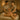 Two massage therapists performing synchronized four-hands massage on client at spa