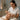 Professional performing microdermabrasion facial treatment on client
