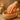 Professional paraffin wax hand treatment being performed in a spa setting
