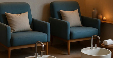 A spa professional and a client smiling while enjoying a comfortable pedicure service in a modern salon.