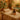 Spa professional warmly greeting a new client with a gift certificate in a serene spa environment