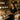 Professional waxing supplies laid out on a spa table, including wax warmers, spatulas, and post-wax care products