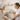 A compassionate esthetician in a spa gently consults with a smiling client, symbolizing trust and personalized care in a professional treatment room