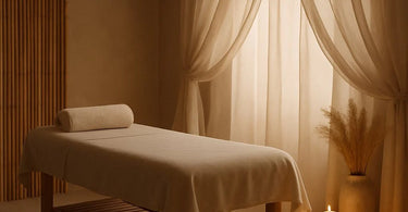 A massage therapist attentively working on a client's back, capturing a moment of silent communication and therapeutic trust on a professional massage table.