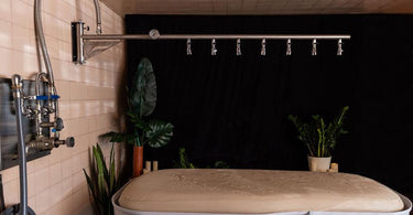 Client enjoying a Vichy Shower treatment in a spa setting