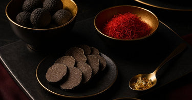 Luxury spa ingredients including caviar, gold, truffles and diamonds arranged beautifully on spa towels