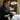 Professional esthetician applying eyelash tint to a client