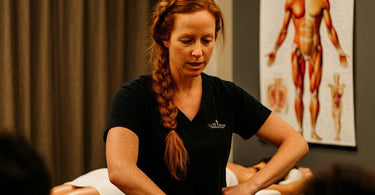 Spa staff receiving training in various massage therapy techniques