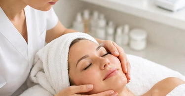 A spa professional performs a gentle lymphatic facial massage on a relaxed client to reduce puffiness and sculpt facial contours.