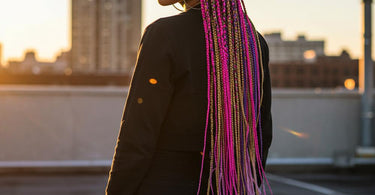 Vibrant RastAfri braiding hair in multiple colors and lengths displayed for salon professionals