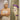 Woman holding timer while waiting to shower after Brazilian wax