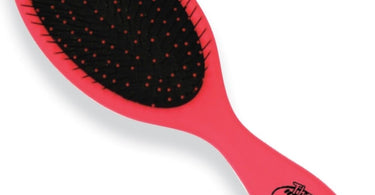 Wet Brush Detangling After Shower Brush in Pink by Wet, featured on a spa towel
