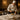An elegantly set spa treatment room with neatly folded towels, a robe, and treatment products, resembling the careful presentation of a fine dining table.
