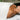 Spa professional preparing a treatment table with a drape sheet