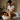 A serene spa setting with a massage table, candles, and towels, emphasizing professionalism and client comfort.