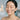 Woman enjoying microdermabrasion facial treatment with visible glow and smooth skin
