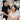 Client experiencing a mirror moment after a professional skin service, admiring her glowing complexion.