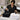 Black and white professional salon and spa towels illustrating visible lint, stains, fading, and laundry care differences