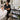 Adjustable height salon cart positioned beside a seated esthetician working on a client, demonstrating ergonomic cart height for seated spa and salon services