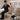 An esthetician and a nail tech working comfortably with carts at the correct ergonomic height, showcasing proper posture and efficiency.