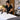 Professional spa treatment room being reset with clean towels, organized tools, and disinfected surfaces between client appointments