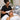 Professional esthetician applying disposable adhesive eye shields to a client's face before a light-based skin treatment in a spa treatment room