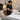 Spa professional offering disposable modesty supplies to a relaxed client in a treatment room, demonstrating proactive client care and comfort