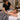 Professional massage treatment room with a client resting under a blanket, illustrating massage table warmth, layered spa bedding, and client temperature comfort during a massage.