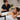 Spa and salon client adjusting an earbud during a professional beauty treatment, illustrating unexpected movement and the importance of client communication during services
