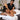 Professional massage therapist providing a relaxing massage treatment to a client in a peaceful spa treatment room