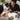 Professional nail technician consulting with a client about an unexpected nail concern before a salon manicure service