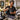 Professional barber maintaining and cooling clipper blades during a busy salon workday