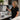 A neatly organized staff training library featuring binders and digital QR codes for easy access to spa and salon equipment manuals and standard operating procedures.