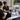 Spa team gathered around a portable massage table during a group training session, with supplies from Pure Spa Direct