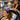 A professional high-frequency therapy machine with a comb electrode being used on a client's scalp in a modern hair salon, showcasing the gentle violet glow and the relaxing treatment experience.
