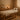 Professional massage therapist using a high-end adjustable massage table in a spa setting