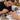 Professional nail artist positioning decorative nail charms on a detailed manicure before securing and curing