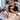 Professional nail polish colors compared under indoor salon lighting and natural window daylight to demonstrate differences in color appearance and undertones