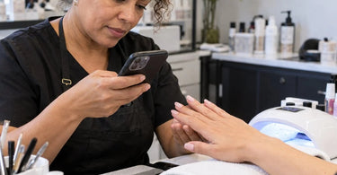 Close-up professional manicure photography highlighting nail polish shine, surface reflections, nail shaping, and small finishing details visible in photos