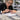 Professional nail tip application troubleshooting showing nail tips and nail adhesive used to prevent premature tip detachment before acrylic or gel enhancements