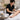 Professional esthetician performing a pre-wax cleansing treatment on a client's skin in a clean spa setting