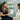 Esthetician preparing client's skin for waxing treatment