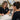 A professional aesthetician writing down product recommendations for a client in a spa treatment room