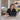 Beauty professional sitting in a salon chair looking at an empty appointment chair, highlighting the need for backup plans to combat no-shows