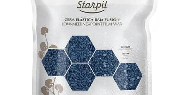 Professional esthetician using Starpil wax products for flawless hair removal results