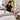 Professional spa treatment room prepared with neatly arranged linens, furniture, lighting, and treatment supplies for repeat clients