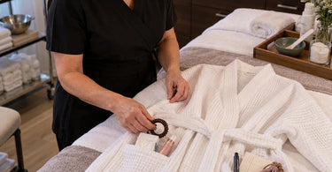 Spa robe pockets and forgotten personal belongings illustrating how professional spa robes become accidental lost-and-found bins during guest treatments and laundry collection
