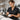 Young beauty school graduate holding scissors and comb looking confident and ready to work in a professional salon environment