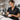 Young beauty school graduate holding scissors and comb looking confident and ready to work in a professional salon environment