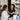 A serene spa employee offering a product recommendation to a smiling client, representing a pressure-free and genuine staff-client interaction.